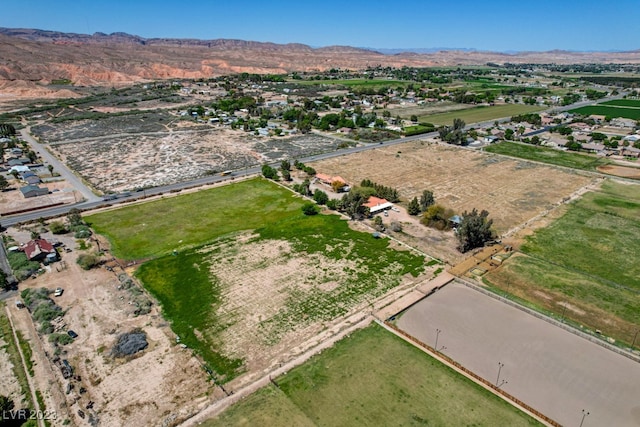 birds eye view of property with a mountain view