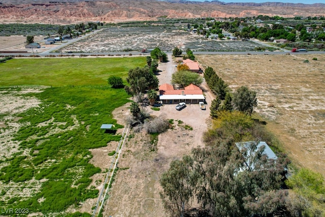 birds eye view of property with a rural view