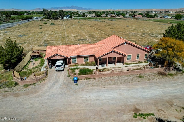 drone / aerial view with a mountain view and a rural view