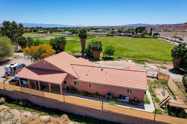 birds eye view of property featuring a mountain view