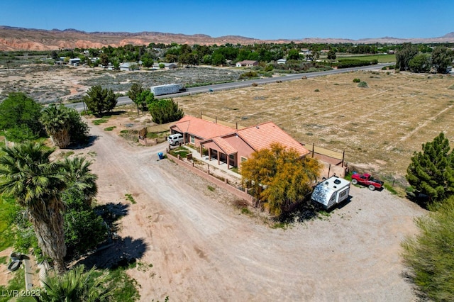 birds eye view of property with a rural view and a mountain view