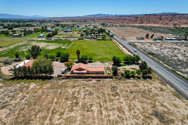 birds eye view of property with a mountain view and a rural view