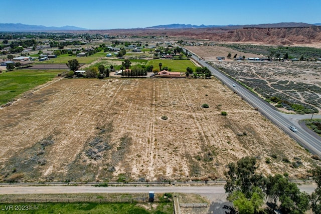 drone / aerial view featuring a rural view and a mountain view