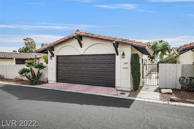 ranch-style home with a garage