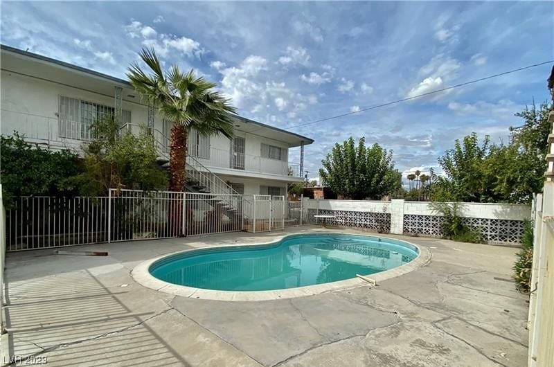 view of swimming pool with a patio