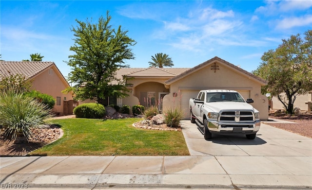 view of front of property featuring a garage and a front lawn