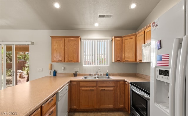 kitchen featuring sink, white appliances, and lofted ceiling