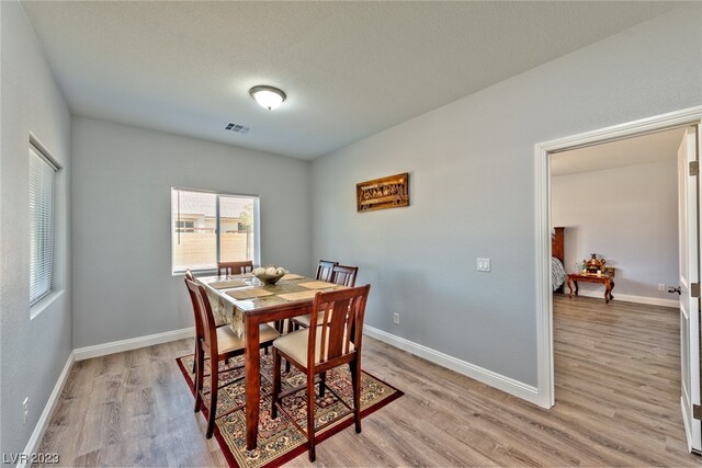 dining room with light hardwood / wood-style flooring