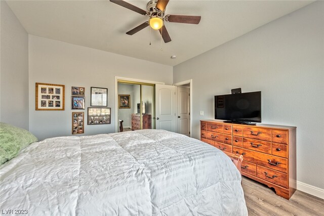 bedroom featuring a closet, ceiling fan, and light wood-type flooring