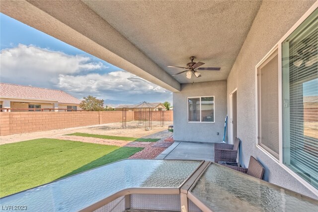 view of patio with ceiling fan