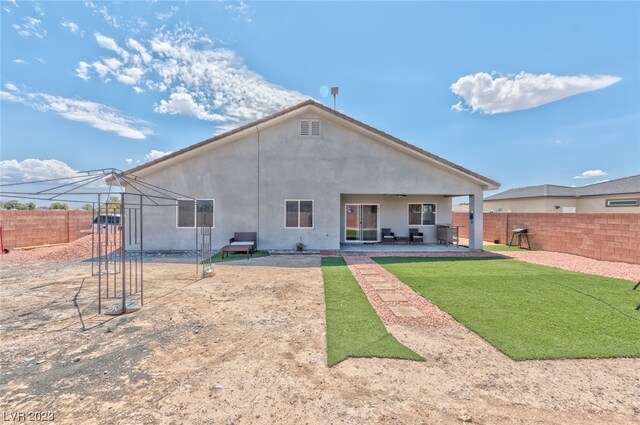 back of property featuring a patio area