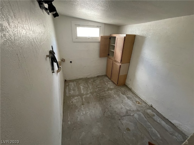 interior space featuring a textured ceiling