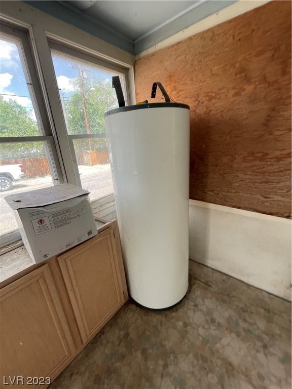 utility room featuring gas water heater