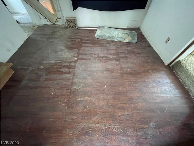 interior details with dark hardwood / wood-style flooring