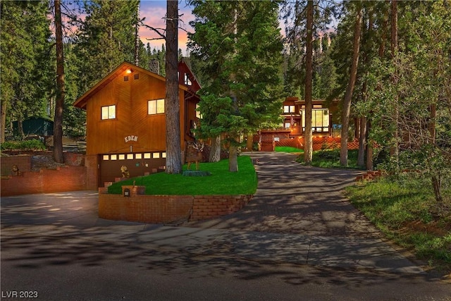 4095 Tyrol Way, Mount Charleston, NV 89124 - chalet / cabin with asphalt driveway and an attached garage