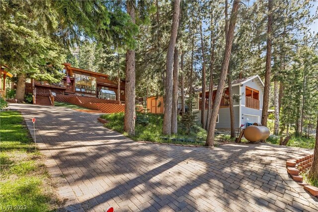 4095 Tyrol Way, Mount Charleston, NV 89124 - view of front of house featuring a wooden deck and an outbuilding