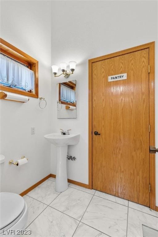 4095 Tyrol Way, Mount Charleston, NV 89124 - half bathroom with marble finish floors and a chandelier