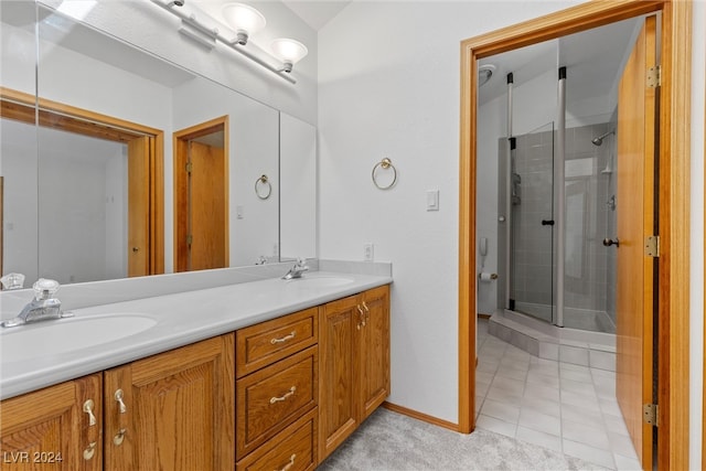 bathroom with vanity, tile patterned floors, and walk in shower