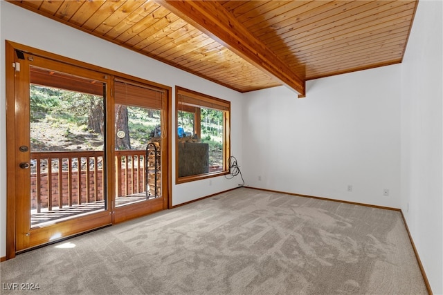 carpeted spare room with wood ceiling and beamed ceiling