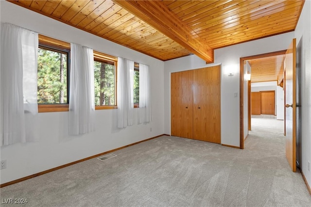 4095 Tyrol Way, Mount Charleston, NV 89124 - unfurnished bedroom with a wooden ceiling with exposed beams, light colored carpet, and a closet