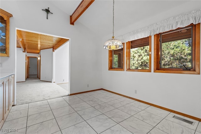 carpeted empty room featuring vaulted ceiling, a notable chandelier, and wooden ceiling