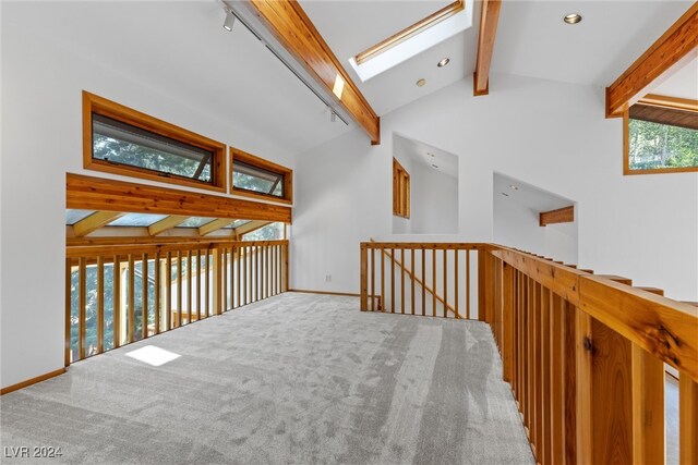 corridor featuring high vaulted ceiling, carpet flooring, and beamed ceiling