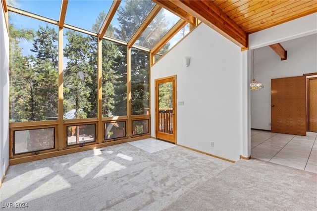 unfurnished sunroom featuring wood ceiling and lofted ceiling with beams