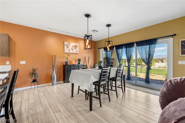 dining space featuring light hardwood / wood-style flooring