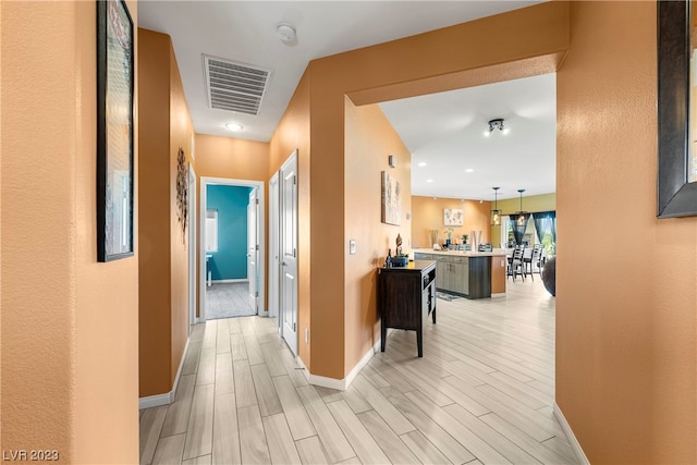 hallway featuring light hardwood / wood-style floors