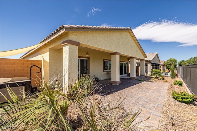 back of property featuring a patio area