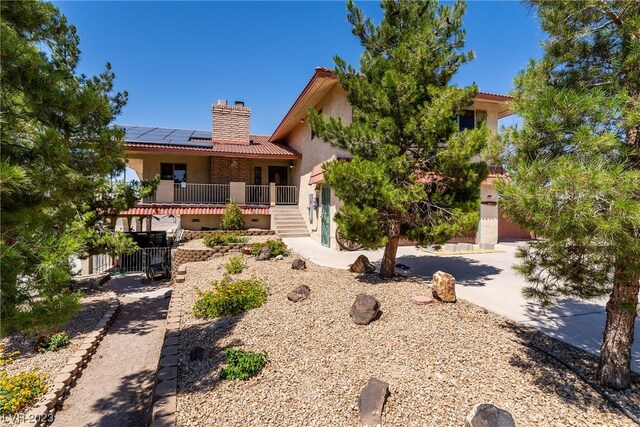 view of front of home with solar panels