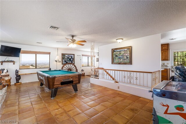 playroom featuring billiards, ceiling fan, a textured ceiling, and light tile floors