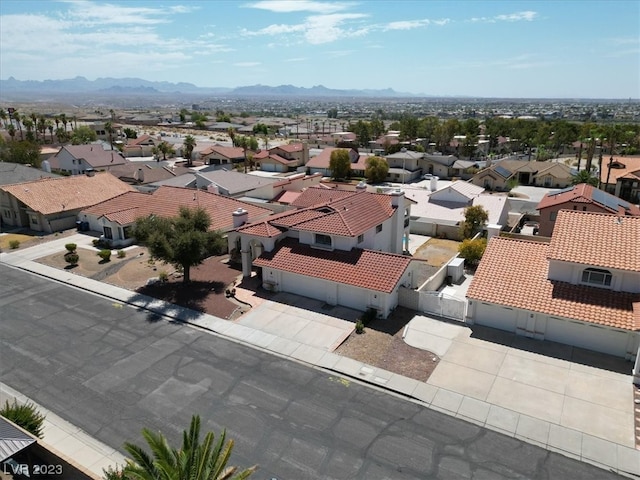 birds eye view of property with a mountain view