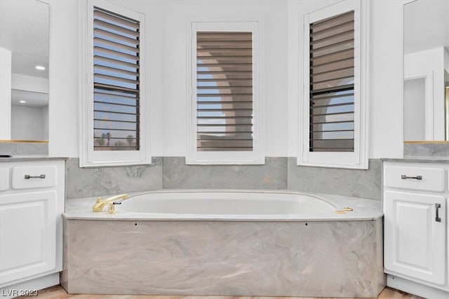 bathroom with a bath to relax in