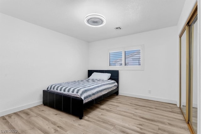 bedroom with light hardwood / wood-style floors