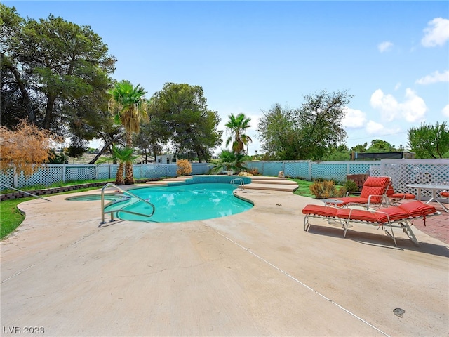 view of swimming pool featuring a patio area