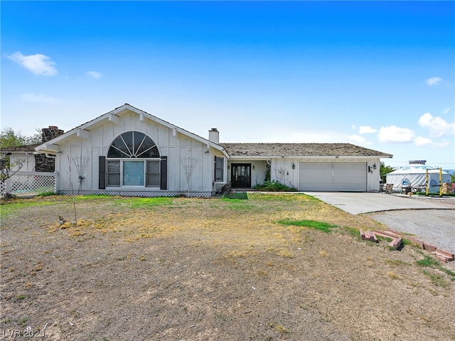 single story home featuring a garage