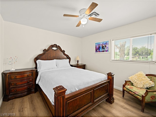 bedroom featuring ceiling fan and light wood-type flooring