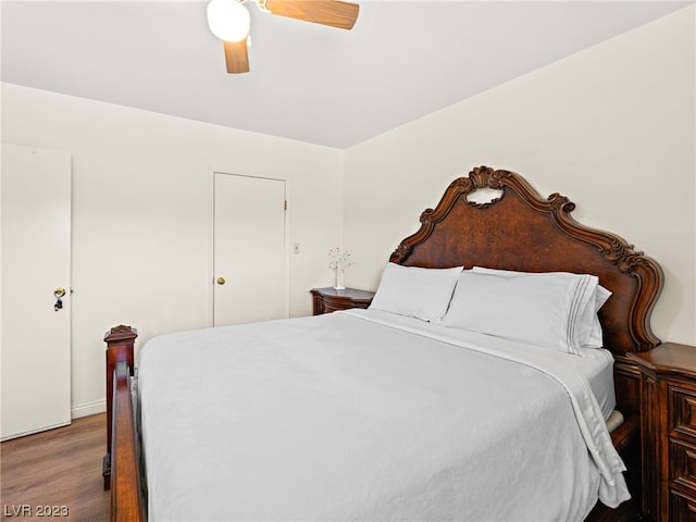 bedroom featuring ceiling fan and dark hardwood / wood-style floors