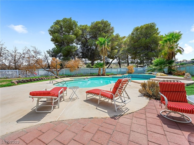 view of pool featuring a patio area