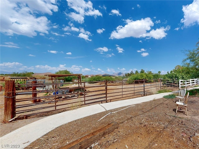 view of yard with a rural view