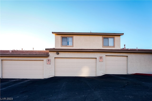 view of property featuring a garage