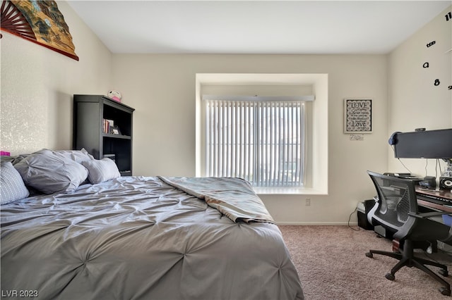 bedroom with light colored carpet