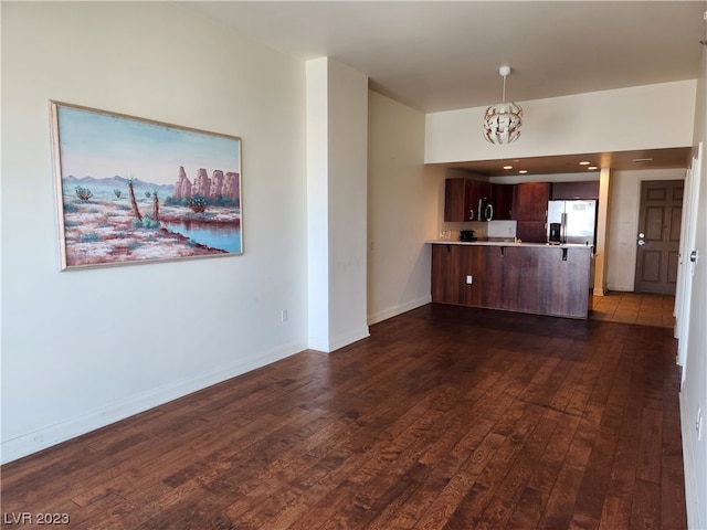 interior space with an inviting chandelier and dark tile floors