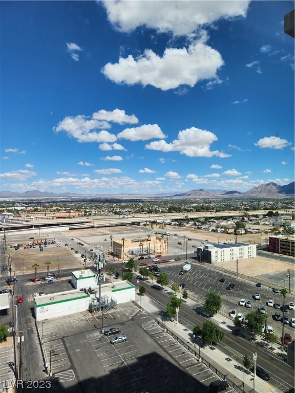 birds eye view of property with a mountain view