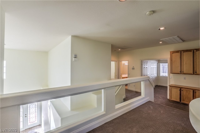 kitchen featuring dark carpet