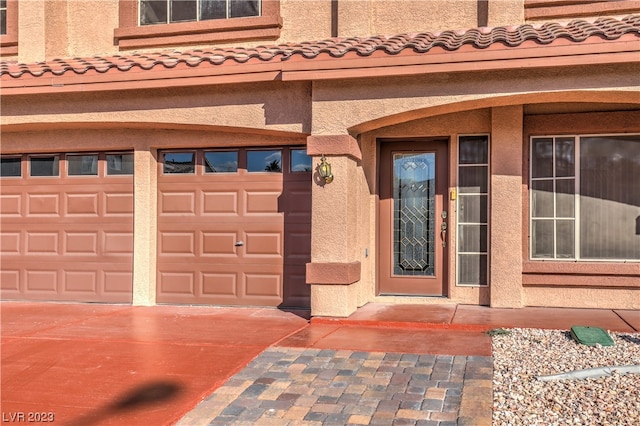 property entrance featuring a garage