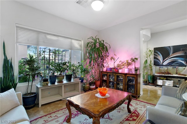 living room featuring light tile floors