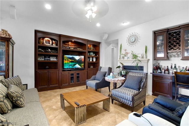 living room featuring ceiling fan and light tile flooring