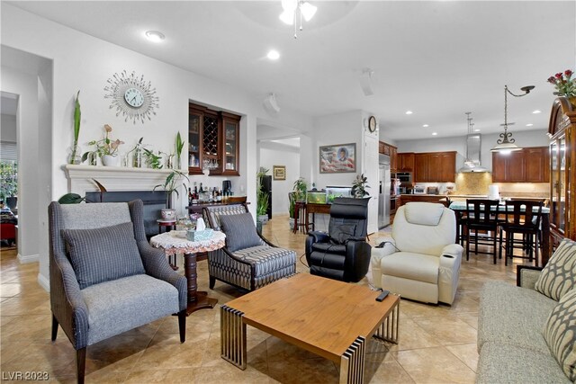 tiled living room featuring ceiling fan